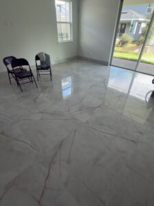 Tile installation in Orlando living room with polished porcelain flooring by Cornerstone Flooring